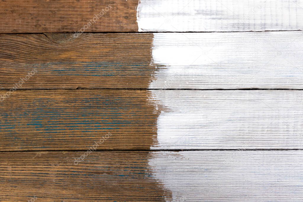 Painted partially white paint structure of old wooden boards with a place for text and background