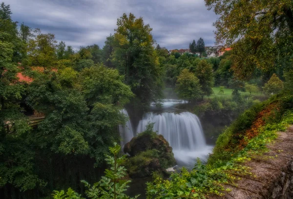 Waterfall Veliki Buk - Big Buk in green nature of Korana river, village of Rastoke, Slunj, Croatia. August 2020. Long exposure picture. — Stock Photo, Image
