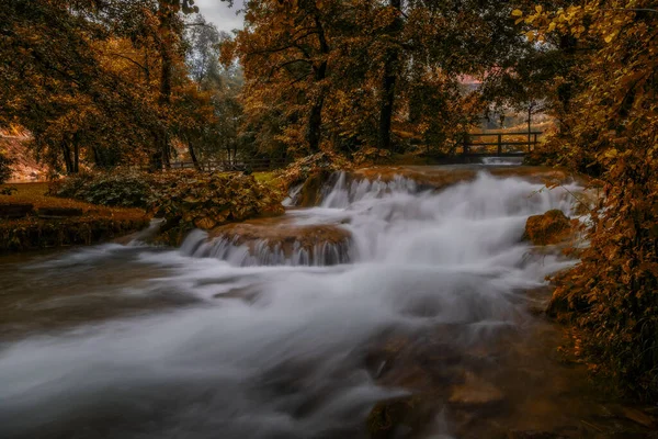 A flowing water of the mountain river in picturesque Rastoke village in Croatia. August 2020, long exposure picture. — Stock Photo, Image