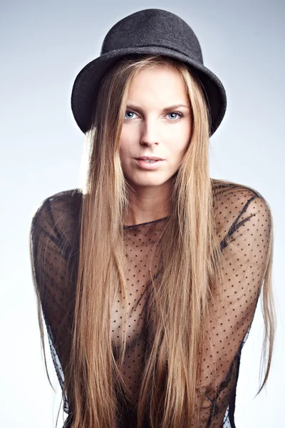 Beautiful young blonde woman in a hat — Stock Photo, Image