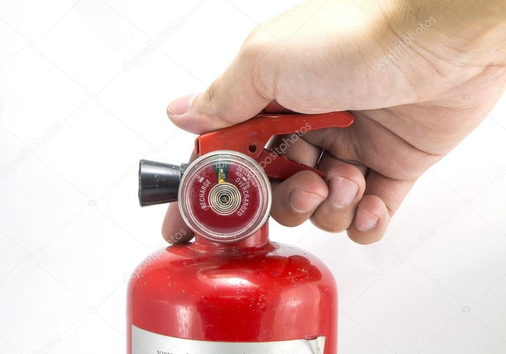 Mini red portable fire extinguisher on white background