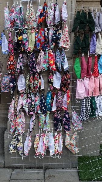 Colorful anti-contagion washable cloth masks for sale on the street in Stockholm