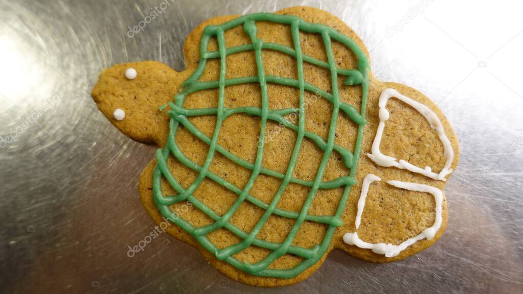 Gingerbread cookie in the shape of a colored turtle