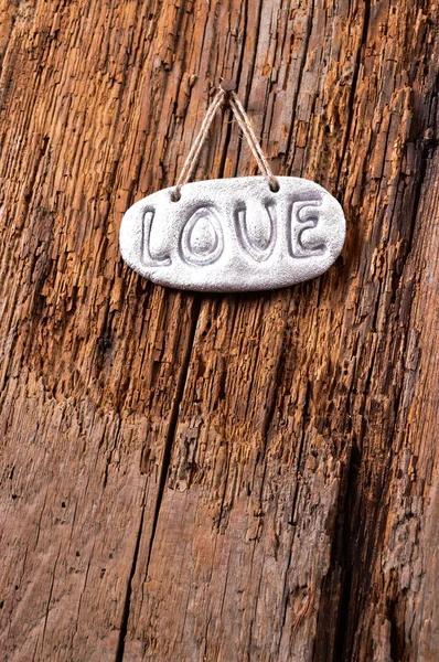 Amor sobre fondo de textura de madera, día de San Valentín . — Foto de Stock