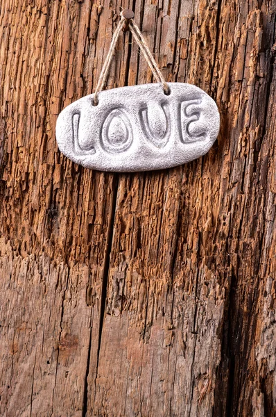 Amor sobre fondo de textura de madera, concepto de tarjeta de San Valentín — Foto de Stock