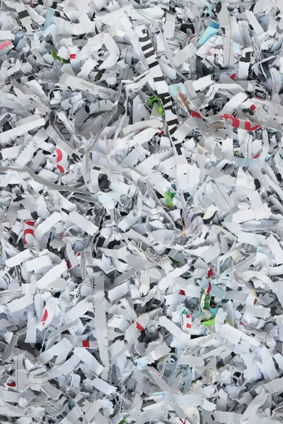 paper scraps as a background, shredded documents