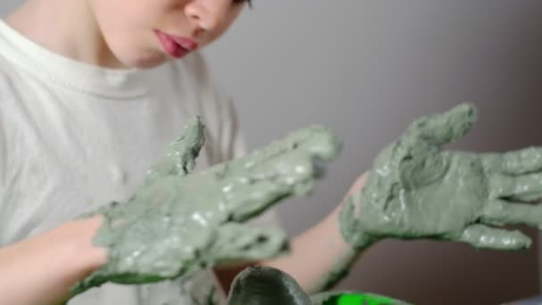 Seven Year Old Boy Soiled Clay Concentrating Making Clay Product — Stock Video