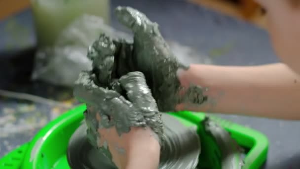 Seven Year Old Boy Soiled Clay Concentrating Making Clay Product — Stock Video