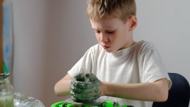 Seven Year Old Boy Soiled Clay Concentrating Making Clay Product — Stock Video