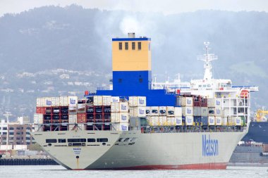 Oakland, CA - Apr 5, 2021: Matson Cargo Ship MANOA entering the Port of Oakland, the fifth busiest port in the United States.