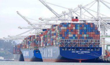 Oakland, CA - Apr 5, 2021: Multiple cargo ships loading at the Port of Oakland, the fifth busiest port in the United States.