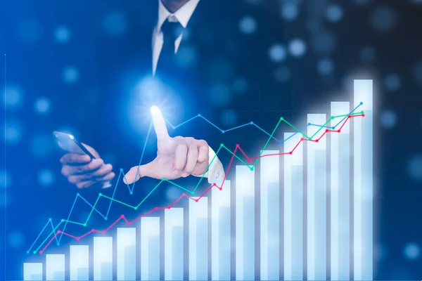 Businessman touch line arrow on the graph chart of stock market ,Technology Process System Business with Investment and stock market concept gain and profits with faded number charts.