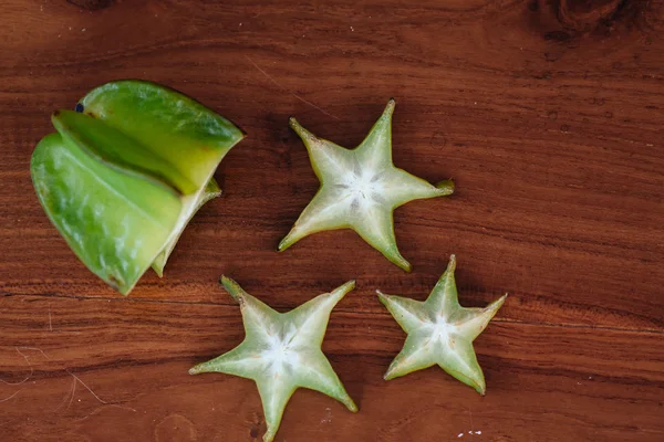 Star apple Carambola (Star Fruit) Fresh ripe star fruit in a wooden table