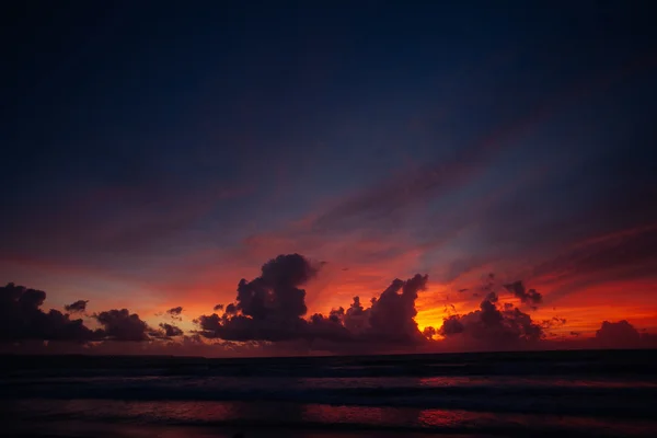 Calm peaceful ocean and beach on tropical sunrise. Bali, Indones