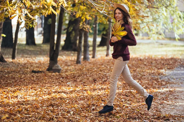 Happy smiling girl jumping /running in the forest. Young woman c — Stock Photo, Image