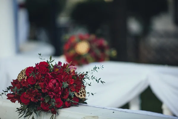 Wedding. Ceremony.Aisle to arch. Marsala floral arrangement of f