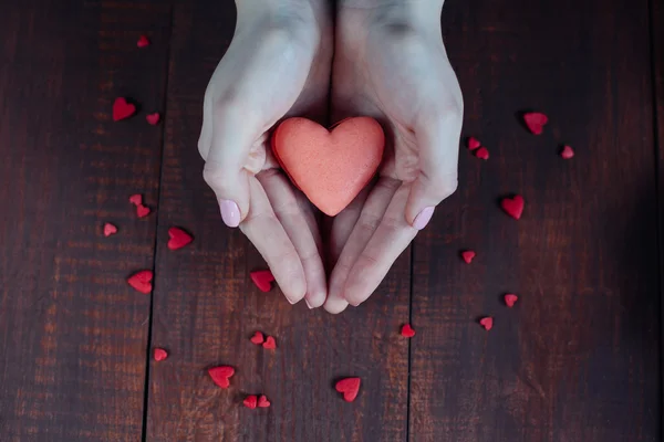 Abstract hands holding valentine macaroons and coffee — Stock Photo, Image