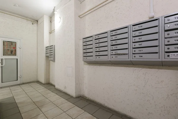 mailboxes in the lobby of an apartment building