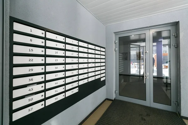 mailboxes in the lobby of an apartment building