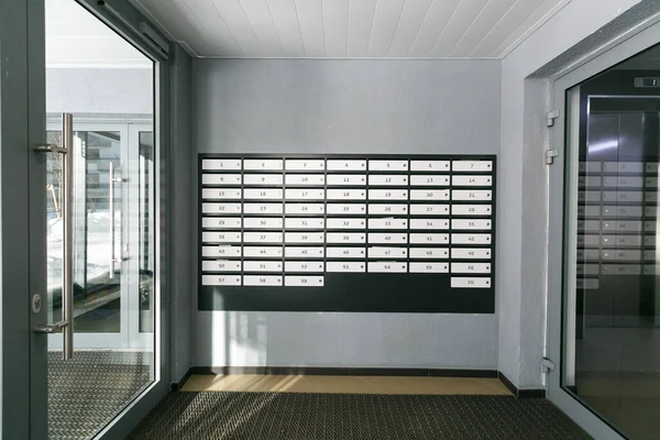 mailboxes in the lobby of an apartment building