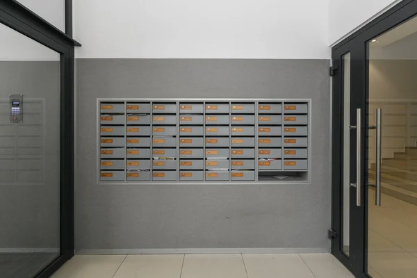 mailboxes in the lobby of an apartment building