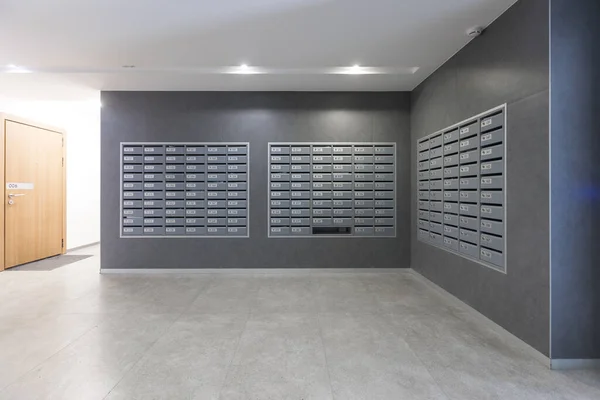 mailboxes in the lobby of an apartment building