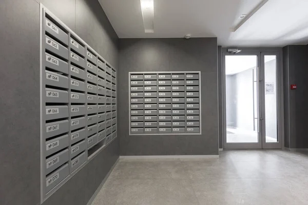 mailboxes in the lobby of an apartment building