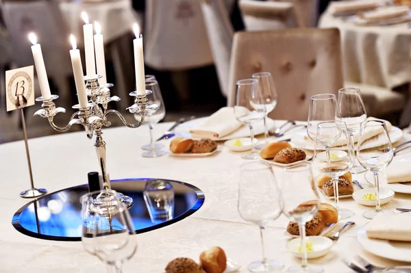 Chandelier on elegant dinner table — Stock Photo, Image