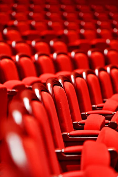 Rows of empty red velvet seats — Stock Photo, Image