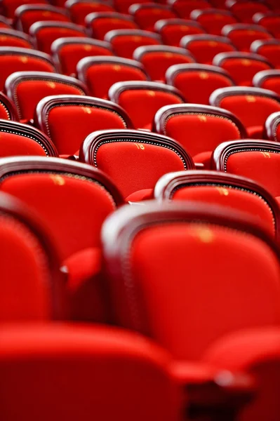 Rows of empty red velvet seats — Stock Photo, Image