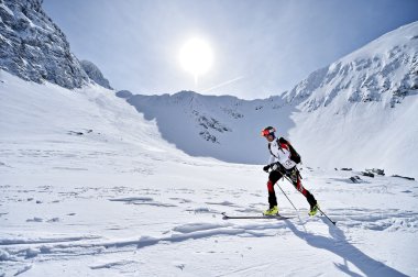 Ski mountaineer during competition in Carpathian Mountains clipart