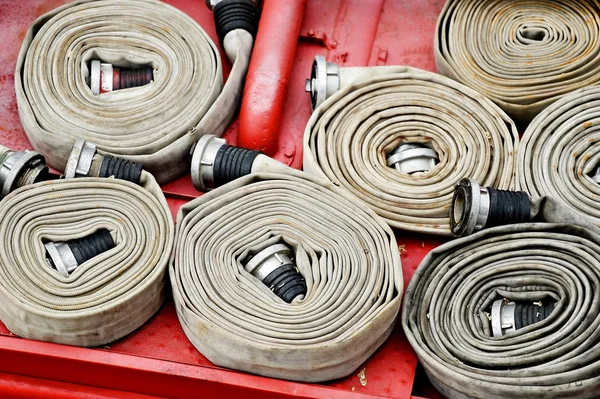 Water hoses on top of a firefighter vehicle — Stock Photo, Image