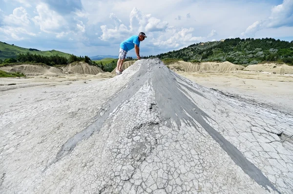 Mud volcanoes landcape with tourists in summer — Stock Photo, Image