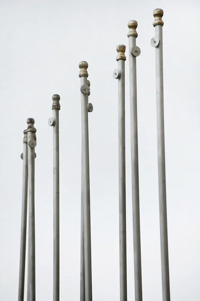 Empty flag poles — Stock Photo, Image