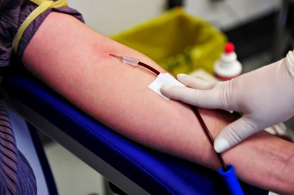 Blood donor hand — Stockfoto