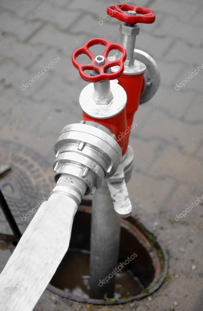 Hose connected to hydrant Photo by ©roibu 65957963