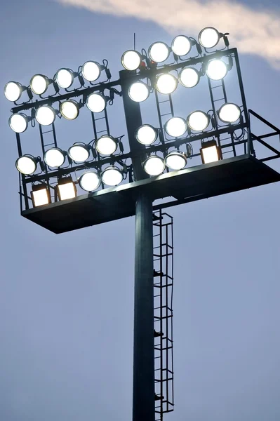 Stadium lights at sunset — Stock Photo, Image