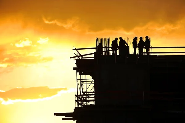 Construction workers silhouettes — Stock Photo, Image