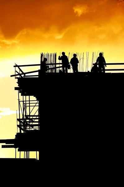 Construction workers silhouettes — Stock Photo, Image