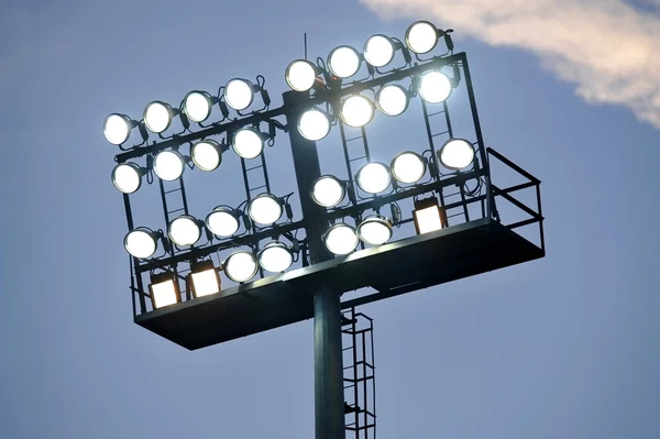 Stadium lights at sunset — Stock Photo, Image