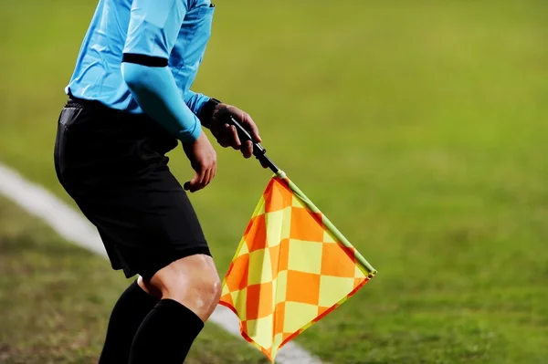 Assistant referee signalling with the flag — Stock Photo, Image