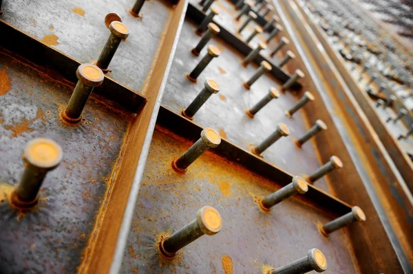 Big bolts on a steel wall — Stock Photo, Image