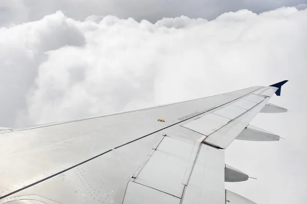 Airplane wing during stormy flight — Stock Photo, Image