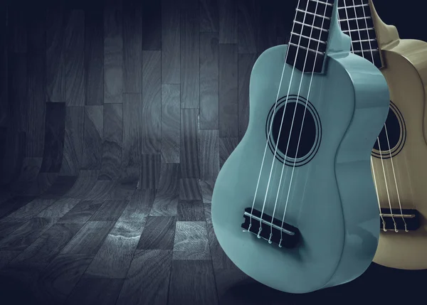 Part of an acoustic guitar on a gray wooden background. — Stock Photo, Image