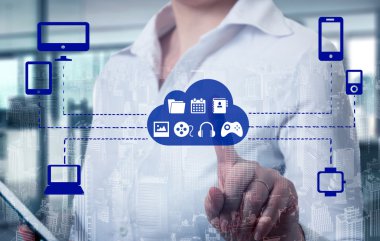 Businesswomen  touching a cloud connected to many objects on a virtual screen, concept about internet of things