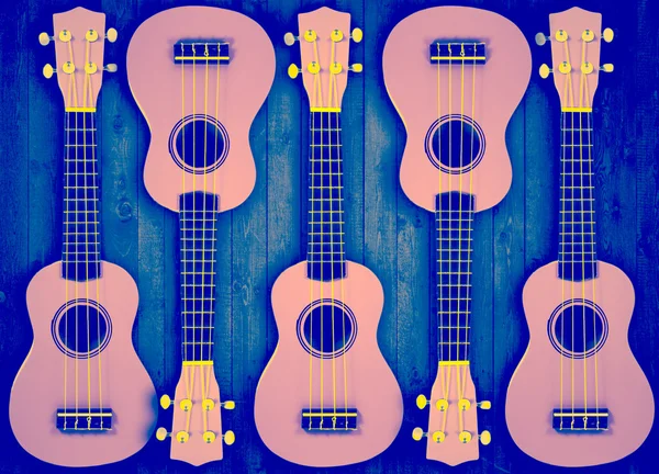 Part of a blue acoustic guitar on gray wooden background. — Stock Photo, Image