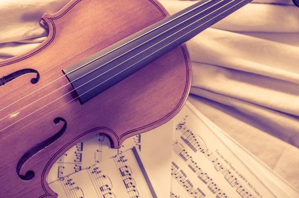 Old violin lying on the sheet of music, music concept Stock Photo by  ©Yra1105 124509822