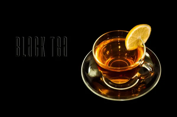 Tea in cup with lemon on black background — Stock Photo, Image