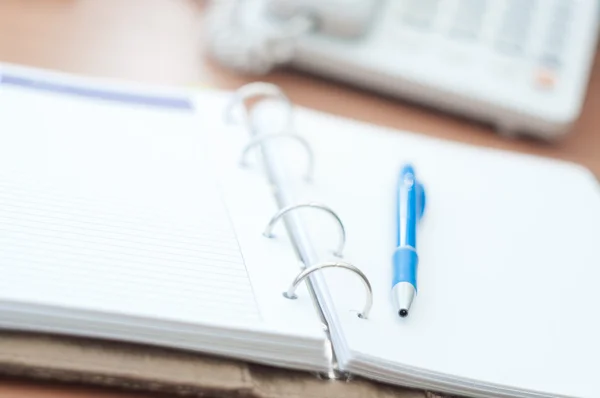 Personal organizer and pen on office desk — Stock Photo, Image