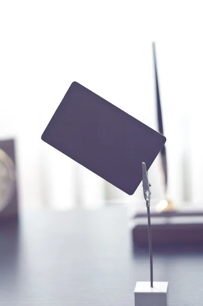 Black mark for label standing on a table. — Stock Photo, Image